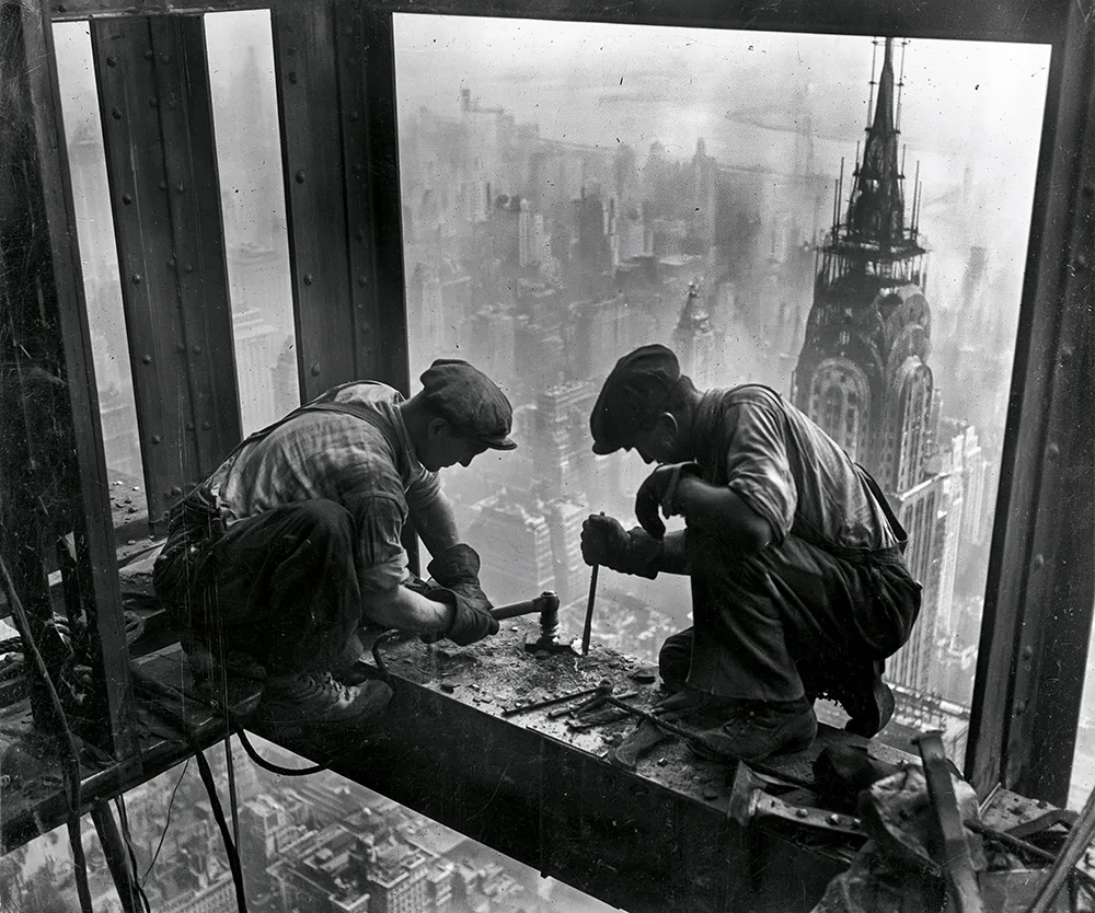 Vintage style image of steelworkers building the Empire State Building's steel frame in 1930